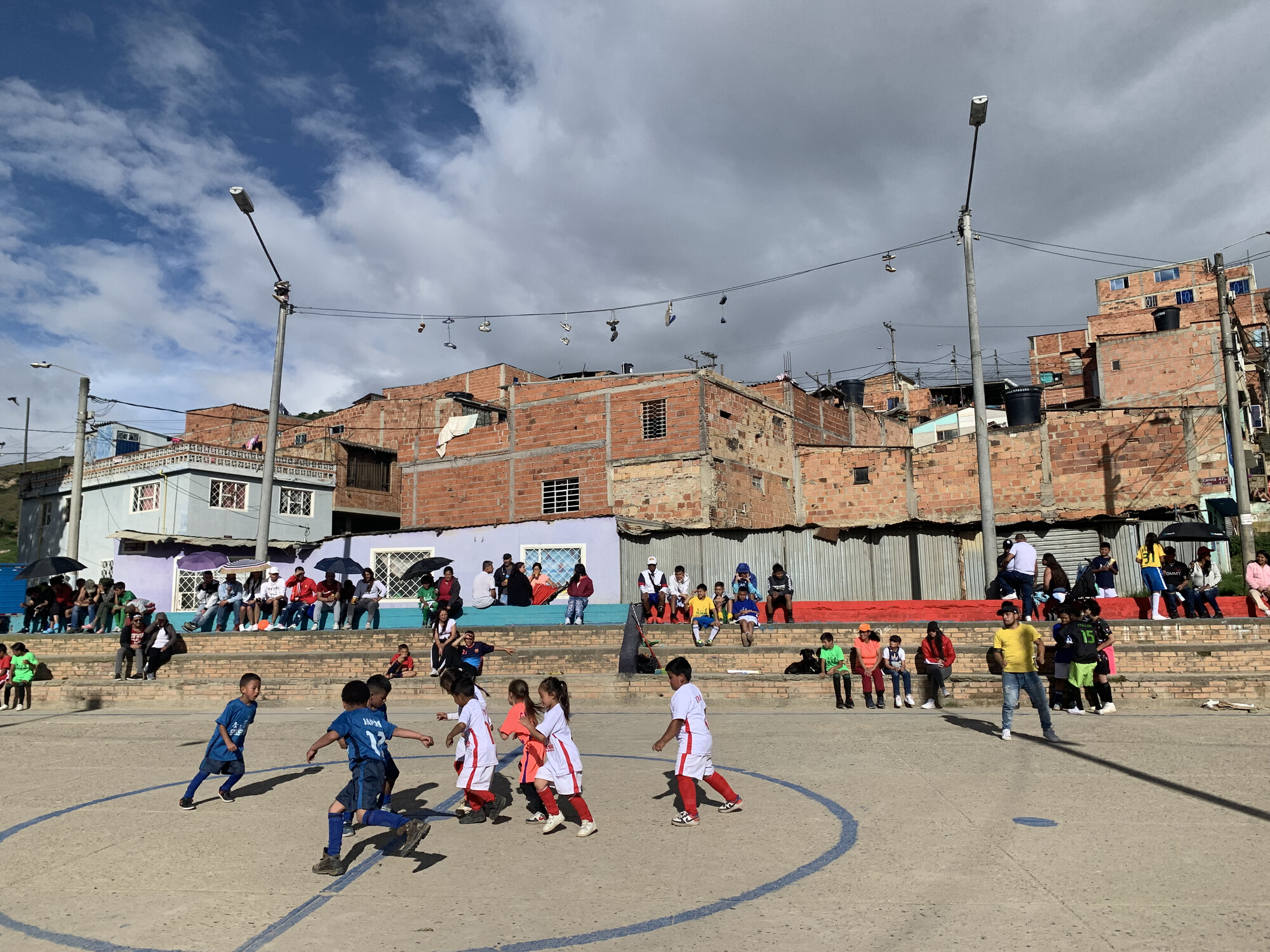 A group of kids play soccer